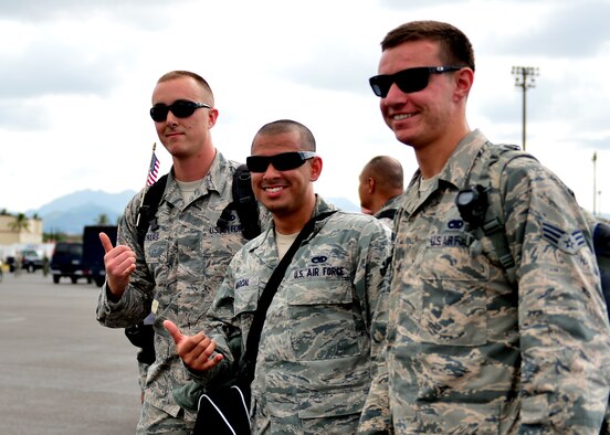 Airmen from the Hawaiian Raptors return home following a six-month deployment, Joint Base Pearl Harbor-Hickam, April 5, 2016. The Hawaiian Raptors are made up of F-22 pilots from the 199th Fighter Squadron and the active-duty 19th Fighter Squadron and are supported by the Hawaii Air National Guard’s 154th Maintenance Squadron and the active-duty 15th Maintenance Squadron. This marked the first operational deployment for the Hawaiian Raptors. (U.S. Air Force photo by Tech. Sgt. Aaron Oelrich/released) 
