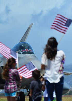 An F-22 Raptor pilot, from the Hawaiian Raptors, runs the shutdown check list as his family waits to great him for the first time in six months, on Joint Base Pearl Harbor-Hickam, April 8, 2016.  The pilot was deployed to the Central Command area of responsibility with the Hawaiian Raptors. The Hawaiian raptors are made up of F-22 pilots from the 199th Fighter Squadron and the active-duty 19th Fighter Squadron and are supported by the Hawaii Air National Guard’s 154th Maintenance Squadron and the active-duty 15th Maintenance Squadron. This marked the first operational deployment for the Hawaiian Raptors. (U.S. Air Force photo by Tech. Sgt. Aaron Oelrich/released)