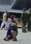 A boy greets his father, a F-22 pilot from the Hawaiian Raptors, for the first time in six months, on Joint Base Pearl Harbor-Hickam, April 8, 2016. The F-22 pilot returned home after a six-month deployment to the Central Command area of responsibility with the Hawaiian Raptors.  The Hawaiian Raptors are made up of F-22 pilots from the 199th Fighter Squadron and the active-duty 19th Fighter Squadron and are supported by the Hawaii Air National Guard’s 154th Maintenances Squadron and the active-duty 15th Maintenance Squadron. This marked the first operational deployment for the Hawaiian Raptors. (U.S. Air Force photo by Tech. Sgt. Aaron Oelrich/released) 