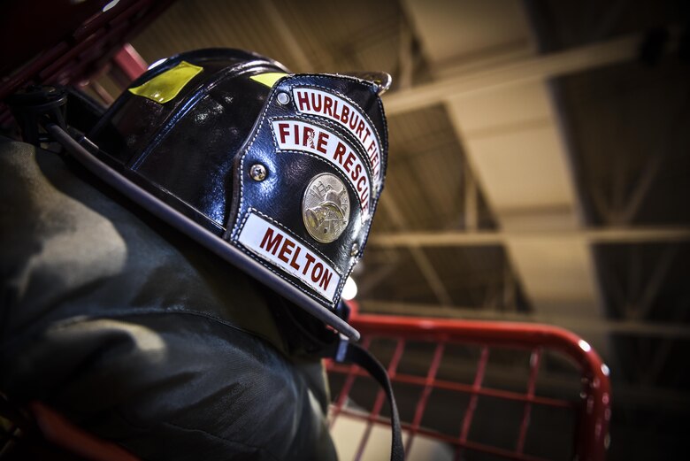 A firefighter’s helmet rests on top of an equipment rack at Hurlburt Field, Fla., April 5, 2016. Hurlburt Field firefighters have less than a minute to don their gear and leave the station with the required emergency vehicles. (U.S. Air Force photo by Staff Sgt. Christopher Callaway)