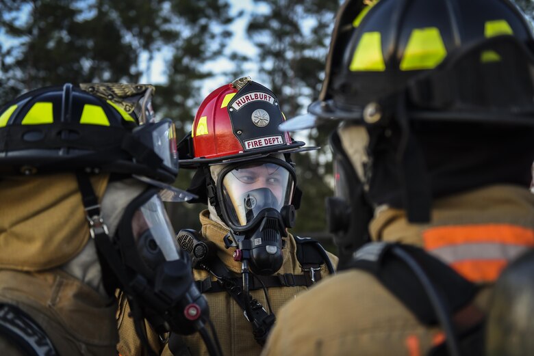 A group of firefighters with the 1st Special Operations Civil Engineer Squadron prepare for a firefighting exercise at Hurlburt Field, Fla., April 5, 2016. Hurlburt Field firefighters transform training and exercise throughout the year to remain ready for emergency responses. (U.S. Air Force photo by Staff Sgt. Christopher Callaway) 