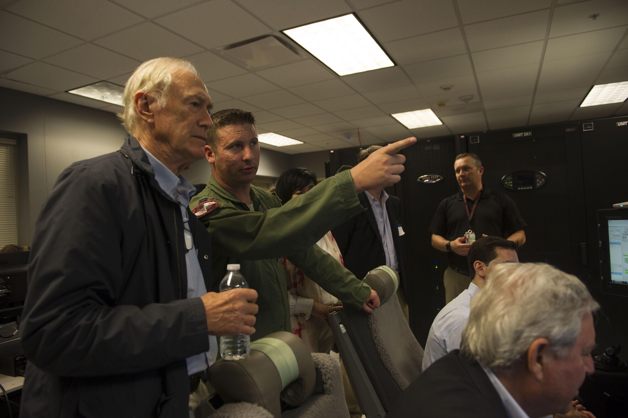 Participants in the Business Executive for National Security tour get briefed on the remotely-piloted aircraft stations in the 19th Special Operations Squadron training facility at Hurlburt Field, Florida.  The 17-person BENS group spent a day getting an orientation with Air Force Special Operations Command missions and Air Commandos.  (U.S. Air Force photo/Senior Airman Krystal M.Garrett)