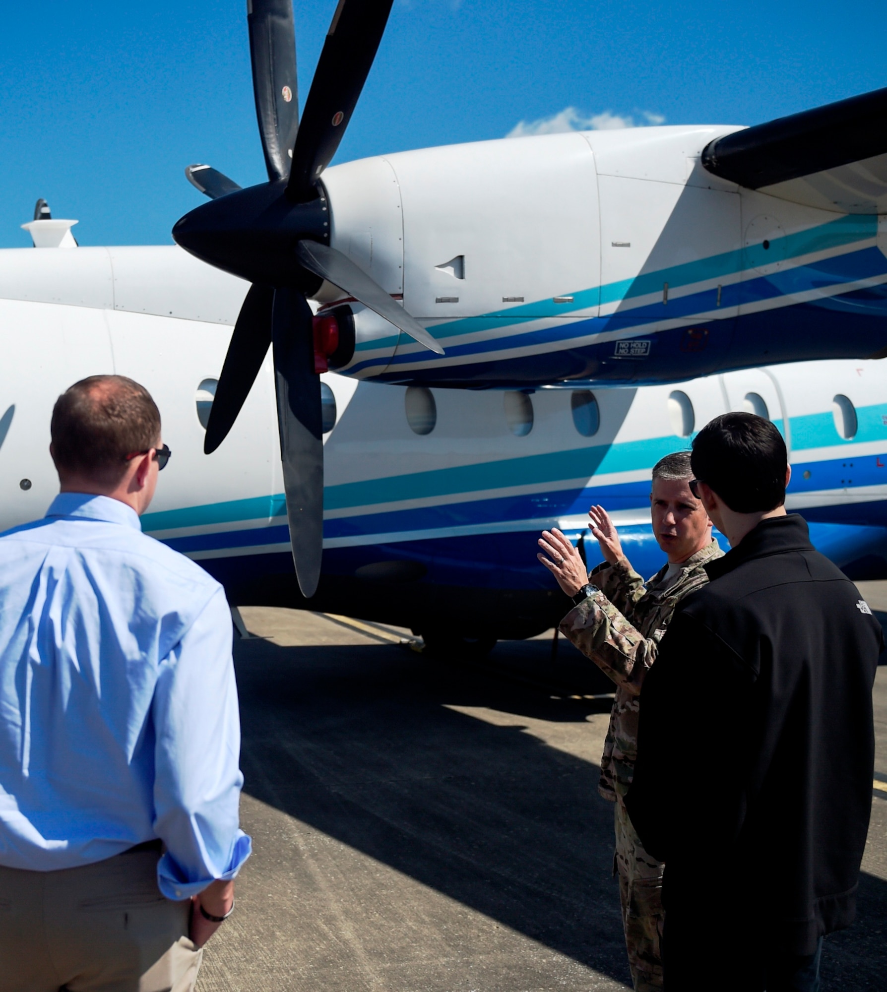Airmen with the 919th Special Operations Wing explain the capabilities of a C-146A Wolfhound aircraft during the Business Executives for National Security tour at Hurlburt Field, Fla., April 7, 2016. The 17-person BENS group spent a day getting an orientation with Air Force Special Operations Command missions and Air Commandos. (U.S. Air Force photo by Airman 1st Class Kai White)