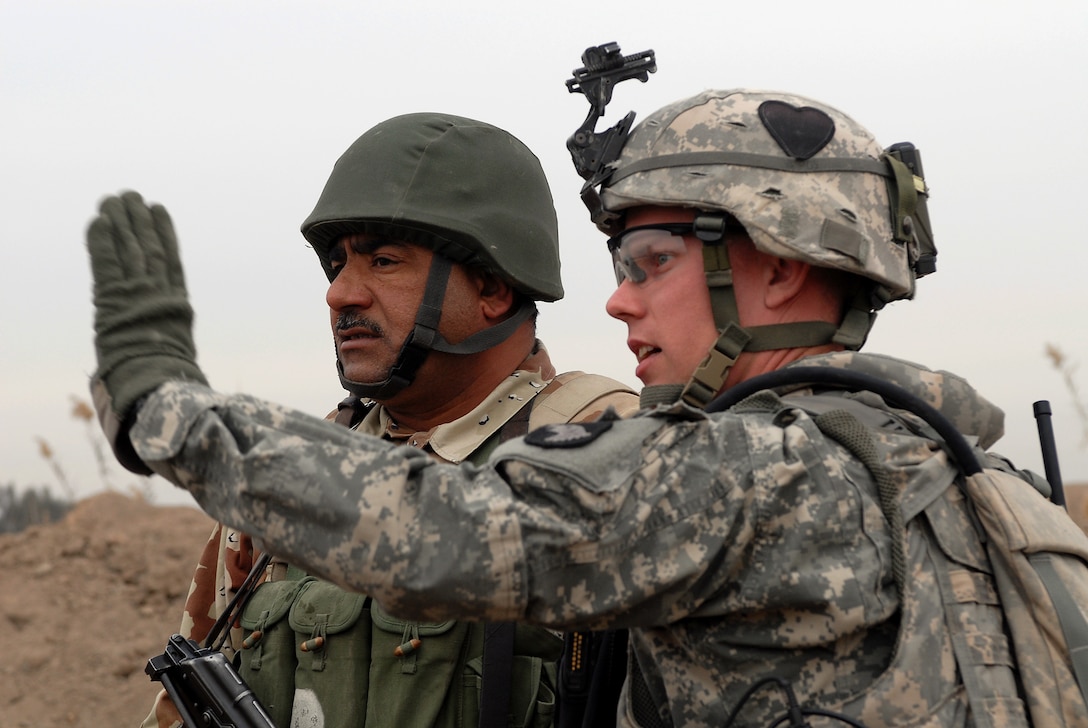 U.S. Army Sgt. 1st Class Calvin Overway, assigned to Charlie Company, 2nd Battalion, 502 Infantry Regiment, 101st Airborne Division, talks with an Iraqi soldier during Operation NANNO II in Baghdad, Jan. 10, 2008. U.S. soldiers from Charlie Company, 2-502 2nd Brigade, 101st Airborne Division, worked with the Iraqi army to go after al-Qaida operatives. Two U.S. counterterrorism airstrikes recently carried out in northwestern Syria on al-Qaida operatives were targeting leaders of the organization’s “original gangsters,” U.S. Central Command spokesman Air Force Col. Pat Ryder told Pentagon reporters, April 8, 2016. Navy photo by Petty Officer 2nd Class Kim Smith