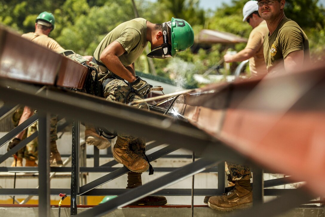 Marine Corps Lance Cpl. Marco Rodriguez welds and prepares metal framing at an elementary school during Exercise Balikatan 2016 in Capiz, Philippines, 2, 2016. The effort is one of multiple community-assistance projects to improve the quality of life for residents and strengthen the bond between the U.S. and the Philippines. Rodriguez is assigned to the 9th Engineer Support Battalion. Marine Corps photo by Cpl. Hilda M. Becerra