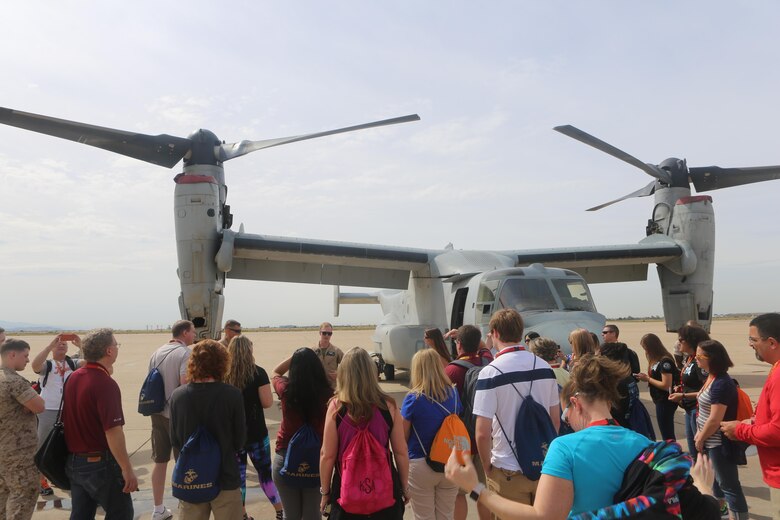 Marines with Marine Medium Tiltrotor Squadron (VMM) 165 brief educators from recruiting stations Lansing, Mich., and Twin Cities, Minn., about the MV-22 Osprey during an Educators Workshop aboard Marine Corps Air Station Miramar, Calif., April 6. Educators visited MCAS Miramar to learn about the aviation side of the Marine Corps and life for a Marine after basic training.