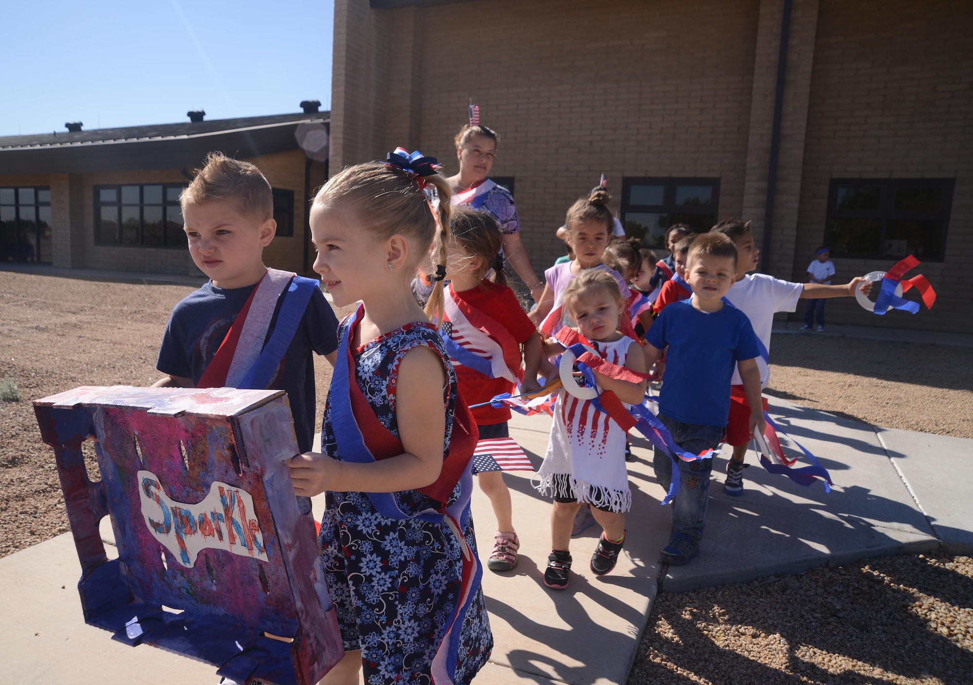 Luke children at the Child Development Center April 1 held a parade to kick off the Month of the Military Child. This awareness month was established to point out the important role children play in the Armed Forces community. There are approximately two million military children; 1.3 million military children are school-aged. The care of military children sustains our fighting force, and strengthens the health, security, and safety of our nation’s families and communities. (U.S. Air Force photo by Denise Willhite)