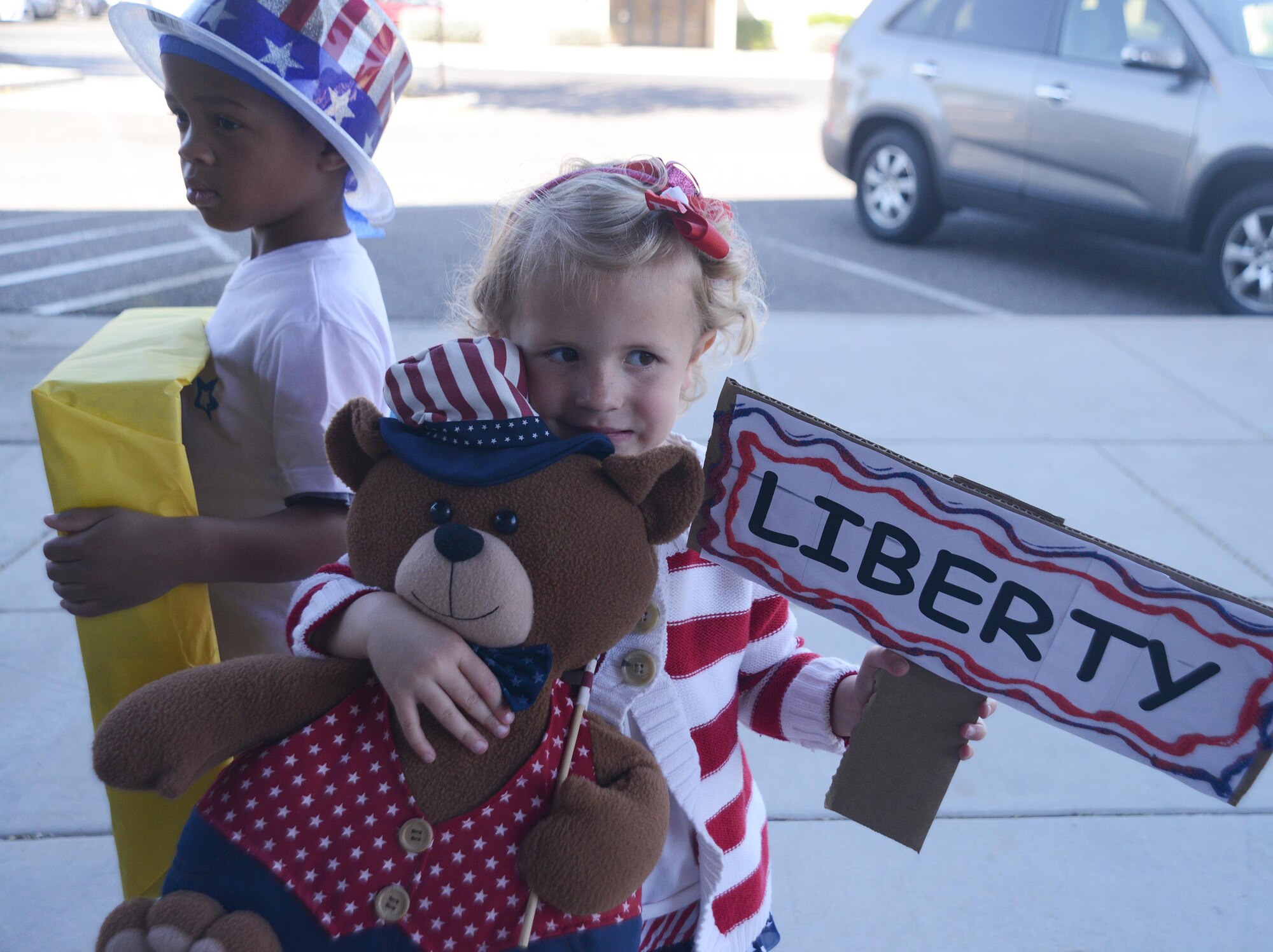 Ellory Ohmer, 4, daughter of Master Sgt. Jory Ohmer, 56th Logistics Readiness Squadron, and Jennifer Ohmer represented the Falcon class April 1, 2016, during the celebration kick-off parade for the Month of the Military Child. Ellory was one of the many Luke children who marched in the parade that was held at Fowler Park on Luke Air Force Base, Arizona. The Month of the Military Child highlights military children all over the world and puts them in the spotlight. (U.S. Air Force photo by Denise Willhite)  