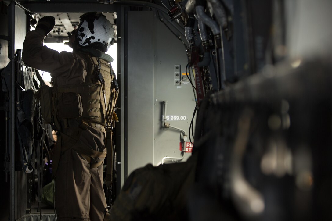 Cpl. Jesus Ontiveros, a crew chief with Marine Medium Tiltrotor Squadron (VMM) 364 “Purple Foxes,” and an Oxnard, California, native, observes a panel aboard an MV-22B Osprey during a flight above Southern California, April 5. Marines with VMM-364 and VMM-165 conducted division confined area landings to build and maintain the pilots’ and air crew’s proficiency in performing the landings. (U.S. Marine Corps photo by Sgt. Lillian Stephens/Released)