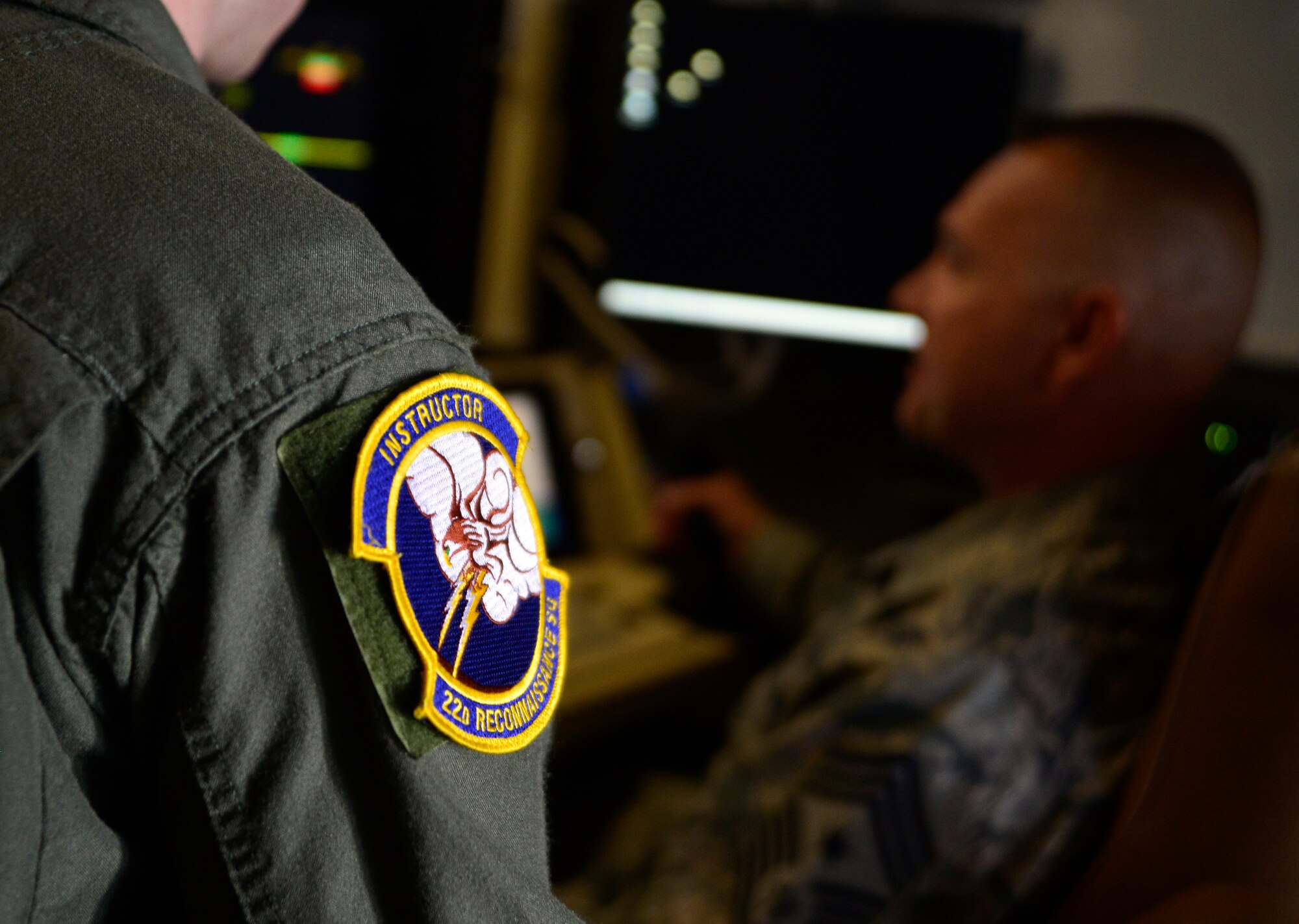 Senior Airman Jacob, 22nd Reconnaissance Squadron sensor operator, explains his job to Chief Master Sgt. Michael Ditore, 432nd Wing/432nd Air Expeditionary Wing command chief April 1, 2016 at Creech Air Force Base, Nevada, Jacob showed the chief the area of responsibility and the unique tools that are specific to the squadron. (U.S. Air Force photo by Senior Airman Christian Clausen/Released)