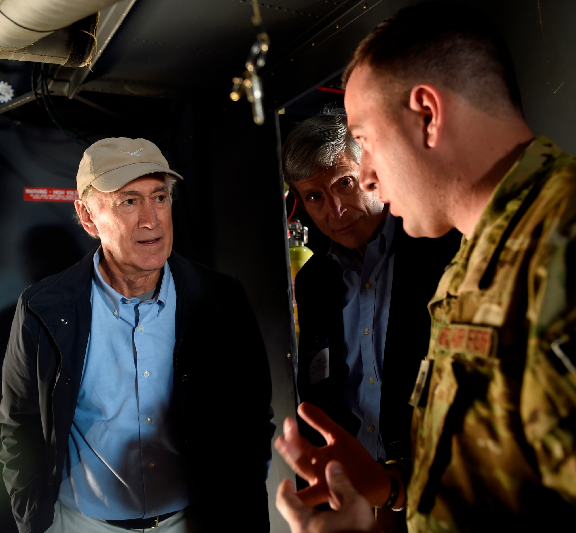 Don Smith and retired Gen. Norton Schwartz listen to the capabilities of a MC-130H during a Business Executives for National Security tour at Hurlburt Field, Fla., April 7, 2016. The 17-person BENS group, led by Schwartz, spent a day getting an orientation with Air Force Special Operations Command missions and Air Commandos. Schwartz is a former AFSOC commander and the 19th Air Force Chief of Staff. (U.S. Air Force photo by Airman 1st Class Kai White)