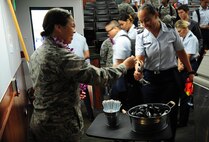 2nd Lt. Allyssa Schimmoeller, 15th Wing alternative Sexual Assault Response coordinator, offers Air Force Reserve Officer Training Corps cadets of Detachment 175 Sexual Assault Awareness and Prevention Month tokens after a documentary viewing and discussion at The University of Hawaii, April 7, 2016. The cadets watched the 2015 documentary "The Hunting Ground," and talked about the realities of sexual assault on college campuses and in the military. (U.S. Air Force photo by 2nd Lt. Kaitlin Daddona/Released)