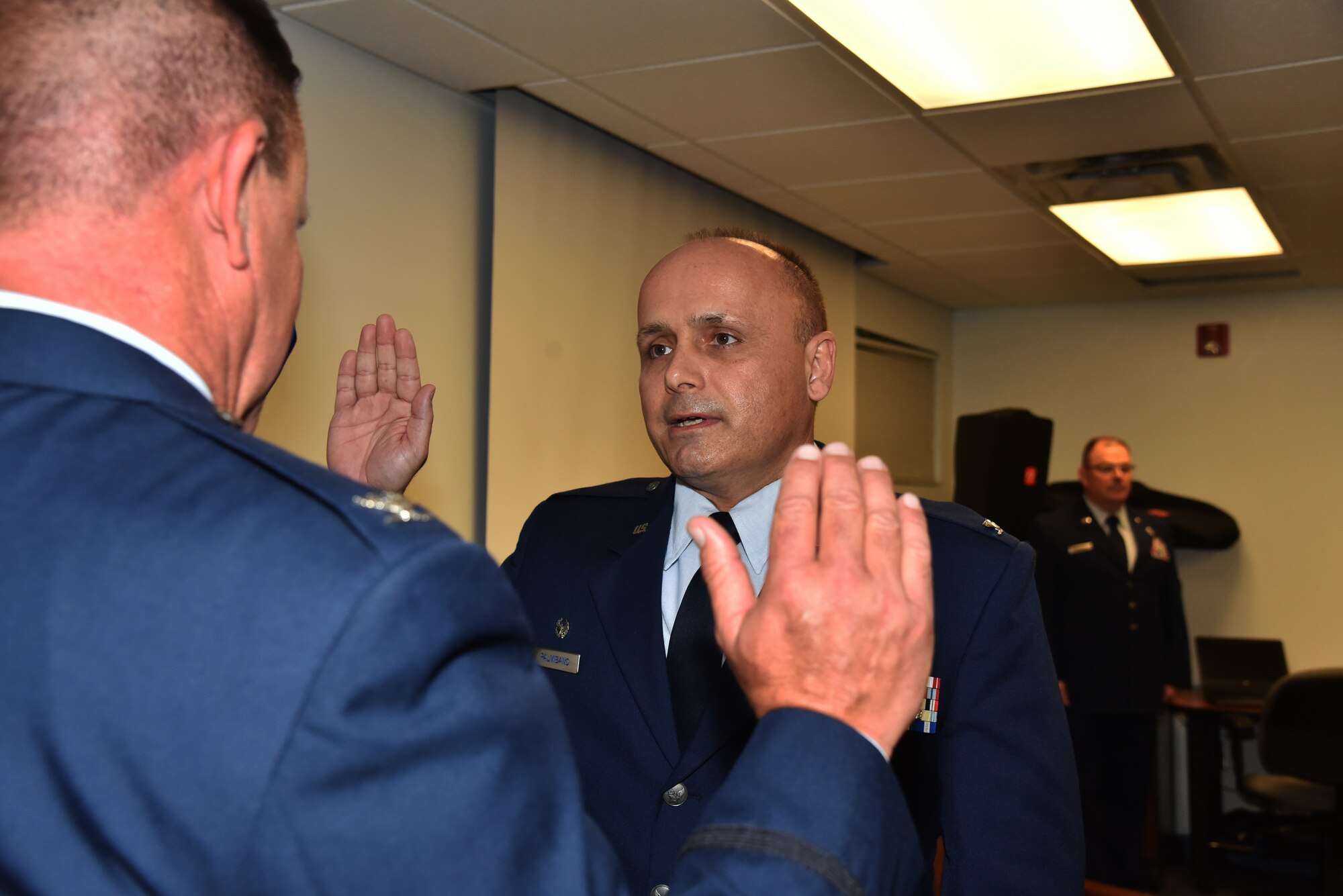 The commander of the 45th Aeromedical Evacuation Squadron, James Palmisano, promotes to the rank of Colonel during his promotion ceremony April 2, 2016, at MacDill Air Force Base. Col. Bill Rolocut, 927th Operations Group, commander, explained how not surprised he was when he was notified of Palmisano’s promotion. “When the promotion list was released, I knew if his name was not on the list, no one had a shot,” said Rolocut. “He is more than deserving of commanding this unit and the promotion to Colonel!” (U.S. Air Force photoby Staff Sgt. Adam C. Borgman)