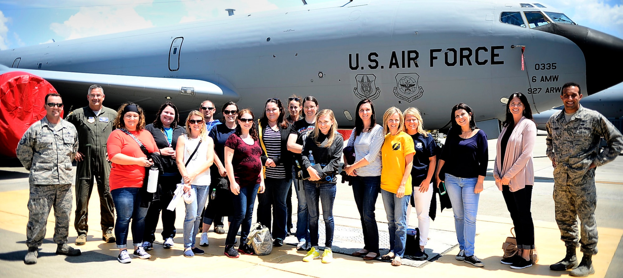 Military spouses pose in front of a KC-135 Stratotanker at MacDill Air Force Base, Fla., April 6, 2016. The 6th Air Mobility Wing hosted a spouse familiarization flight for 26 spouses from around the wing, the flight allowed them to witness the wing’s mission firsthand. (U.S. Air Force photo by Senior Airman Tori Schultz)