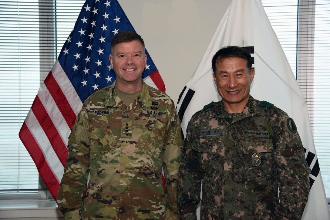 Korean army Lt. Gen Na Sang Woong, the commanding general for the Republic of Korea army visits with U.S. Army Gen. David G. Perkins, commander of U.S. Army Training and Doctrine Command, at Fort Eustis, Va., March 28, 2016.  The visit helped Na gain an understanding of how TRADOC helps shape the future of the U. S. Army. (U.S. Army courtesy photo)