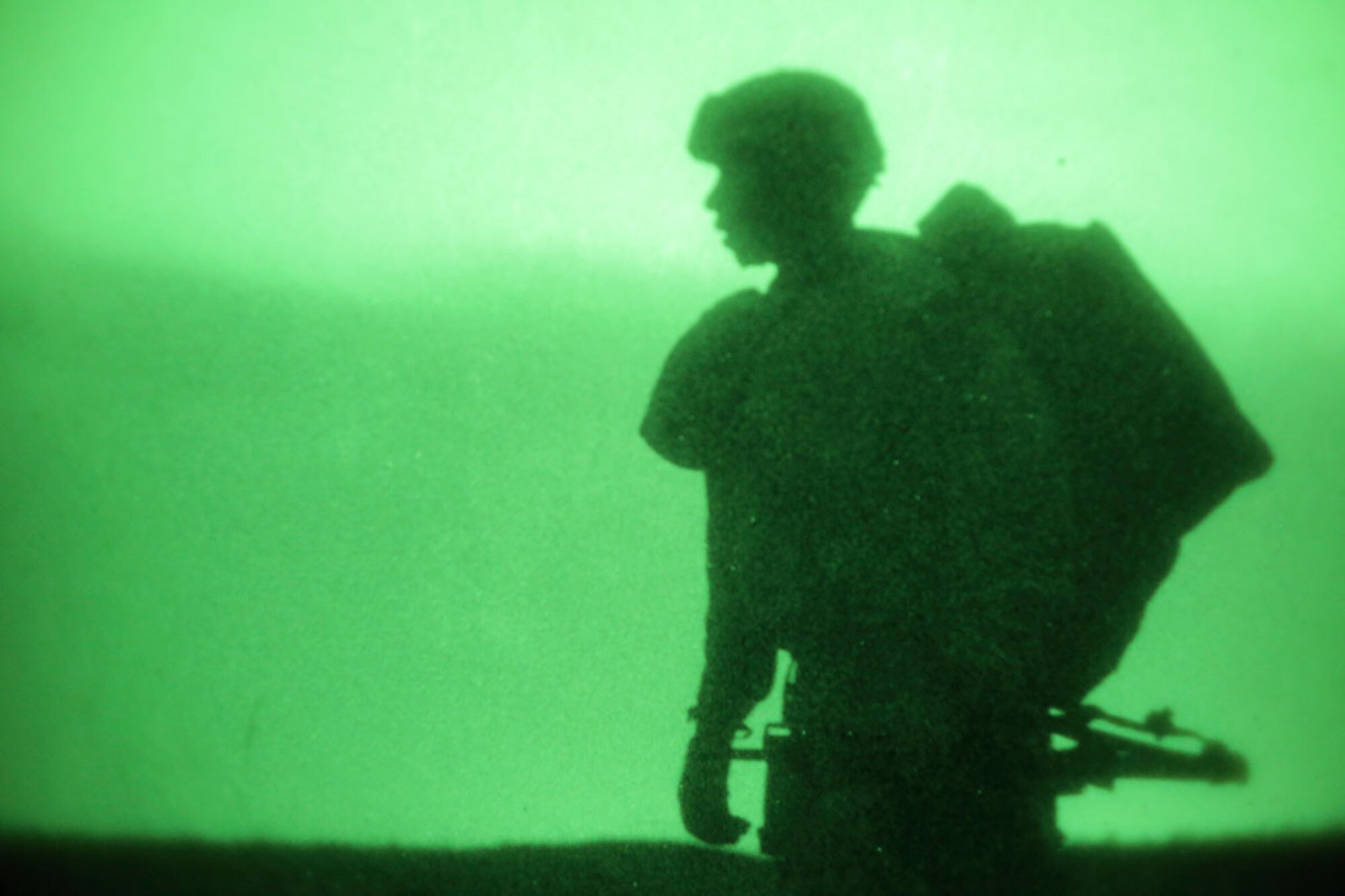 A paratrooper assigned to the 4th Brigade Combat Team (Airborne), 25th Infantry Division, proceeds to the rally point after completing a night jump onto Malemute Drop Zone, Joint Base Elmendorf-Richardson, Alaska, March 31, 2016. The Soldiers of 4/25 belong to the only American airborne brigade in the Pacific and are trained to execute airborne maneuvers in extreme cold weather/high altitude environments in support of combat, partnership and disaster relief operations. (U.S. Air Force photo/Alejandro Pena)