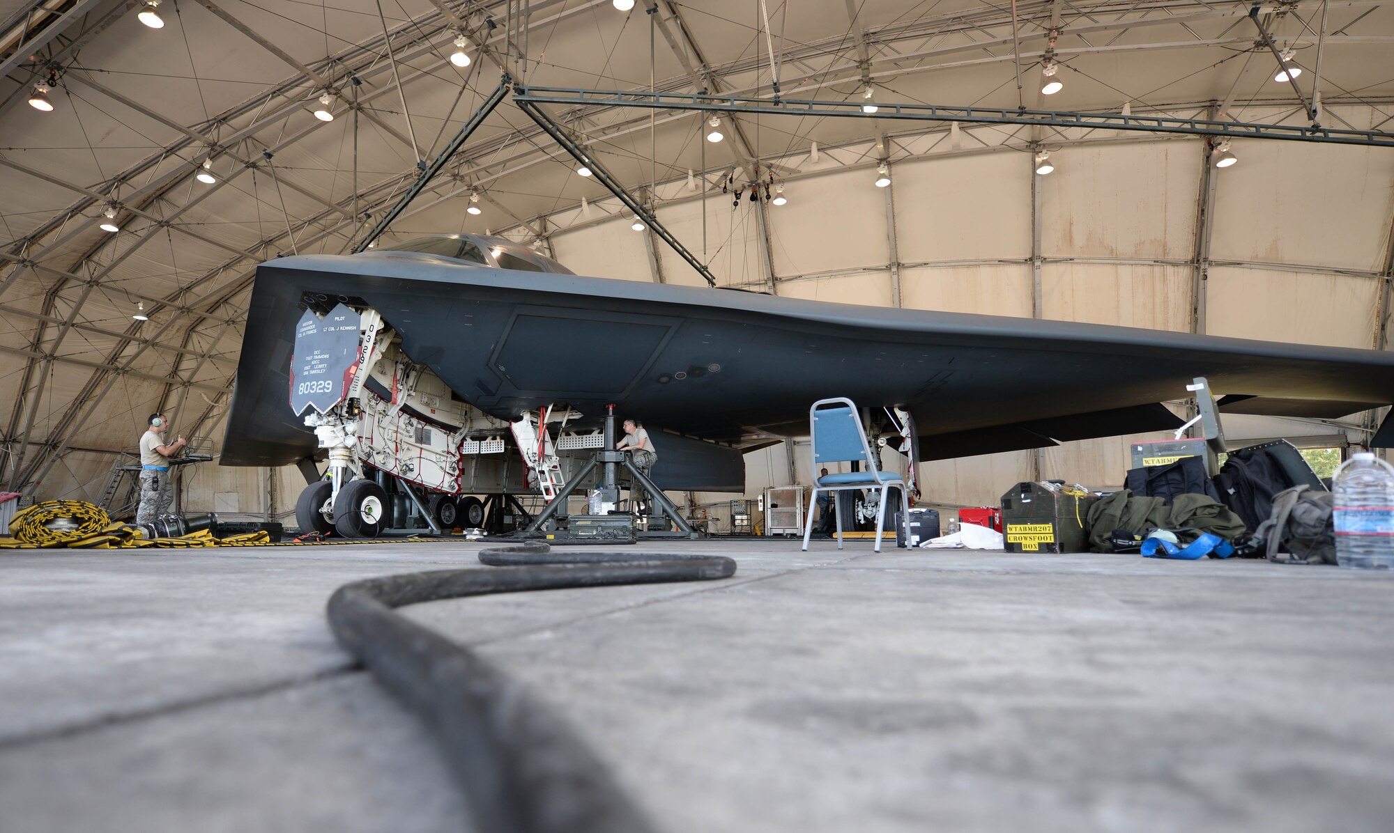 Maintainers from Whiteman Air Force Base, Missouri, perform a gear swing on a U.S. Air Force B-2 Spirit bomber March 13, 2016, in the U.S. Pacific Command area of operations. Strategic Command bombers regularly deploy to the Indo-Asia-Pacific region to conduct PACOM-led operations which provide leaders deterrence options to maintain regional stability. (U.S. Air Force photo by Senior Airman Joel Pfiester/Released)