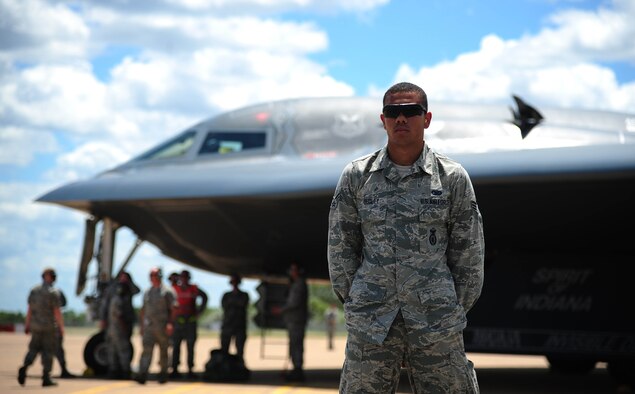 U.S. Air Force Senior Airman Tyler Dudley, a security forces response member with the 509th Security Forces Squadron, guards a U.S. Air Force B-2 Spirit bomber at Royal Australian Air Force Base Tindal, Australia, March 22, 2016, while aircrews conduct an engine running crew change. The B-2 was one of three that were deployed to the Indo-Asia-Pacific region from March 8 through 29 to enhance bomber crew readiness and proficiency and to integrate capabilities with key regional partners. U.S. Strategic Command bombers regularly rotate through the Indo-Asia-Pacific region to conduct theater security cooperation engagements with U.S. allies and partners and demonstrate a shared commitment to promoting security and stability in the region. (U.S. Air Force photo by Senior Airman Joel Pfiester/Released)
