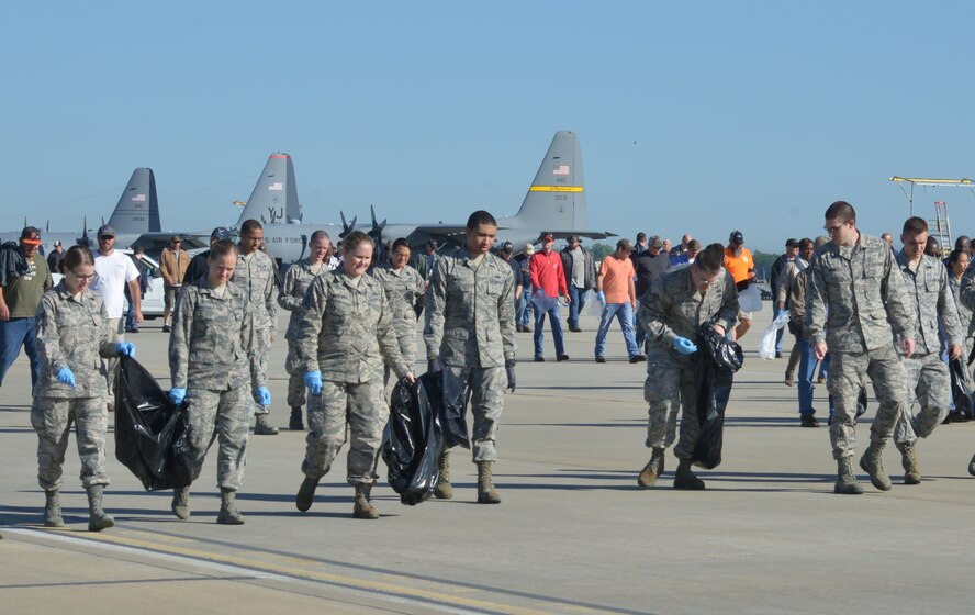 Hundreds of Team Robins members inspect the flight line Monday morning for anything that could cause damage to aircraft following last Friday’s tornado and severe thunderstorms.

Airmen from various Robins squadrons arrived on buses while civilian employees converged from their respective maintenance buildings for the FOD walk. It was a true team effort involving the Warner Robins Air Logistics Complex, 78th Air Base Wing and 5th Combat Communications Group. (U.S. Air Force photo by Ray Crayton)
