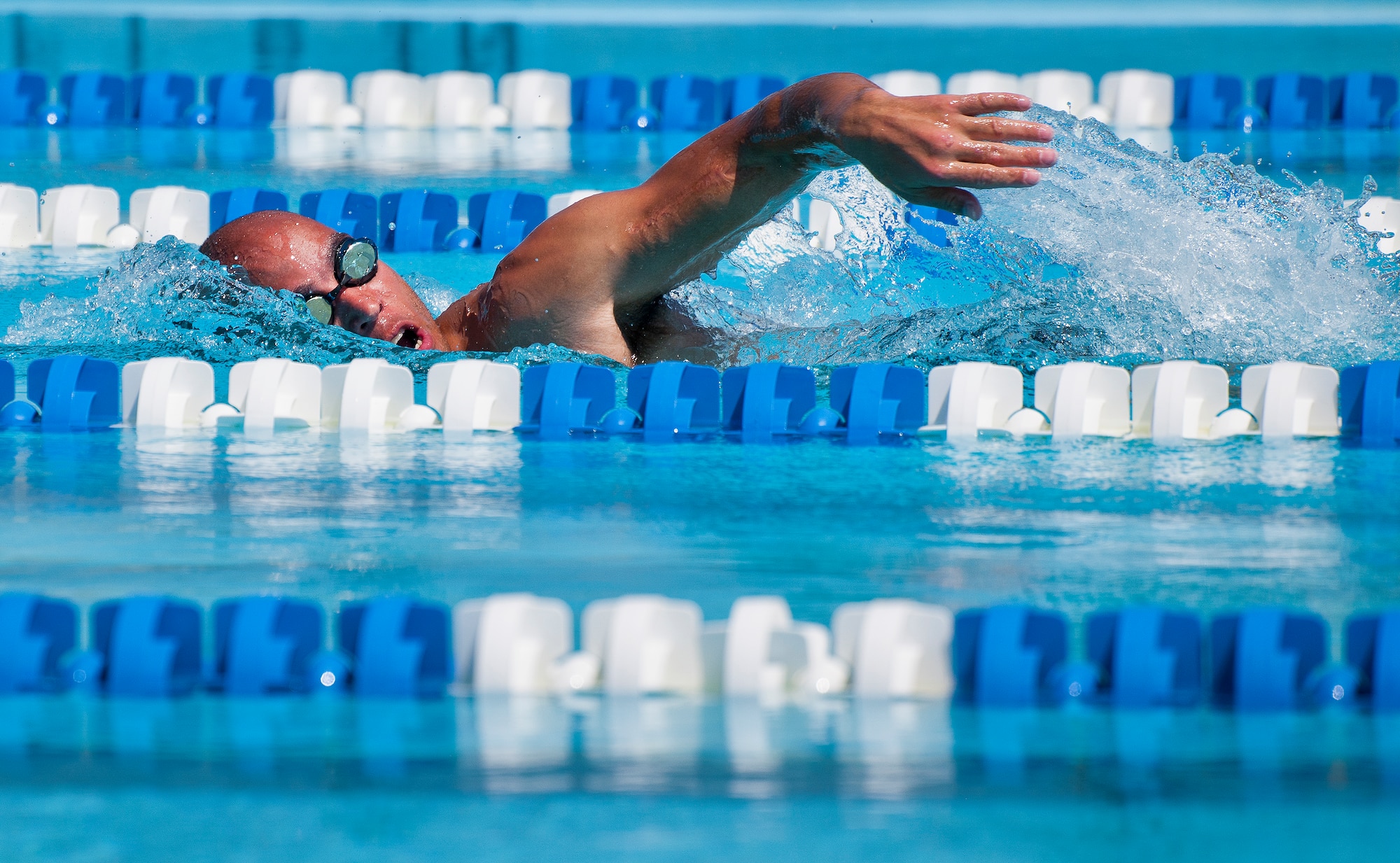 Charles Ming, a Warrior Games athlete, takes in air during an afternoon swim session at the Air Force team’s training camp at Eglin Air Force Base, Fla., April 7. The base-hosted, week-long Warrior Games training camp is the last team practice session before the yearly competition in June. (U.S. Air Force photo/Samuel King Jr.)