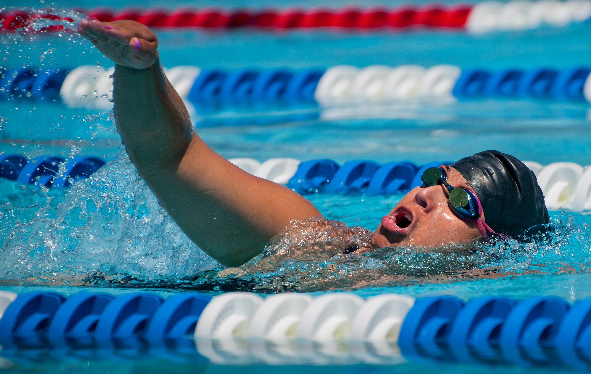 Tonya Perez, a Warrior Games athlete, lifts her head out of the water during an afternoon swim session at the Air Force team’s training camp at Eglin Air Force Base, Fla., April 7. The base-hosted, week-long Warrior Games training camp is the last team practice session before the yearly competition in June. (U.S. Air Force photo/Samuel King Jr.)
