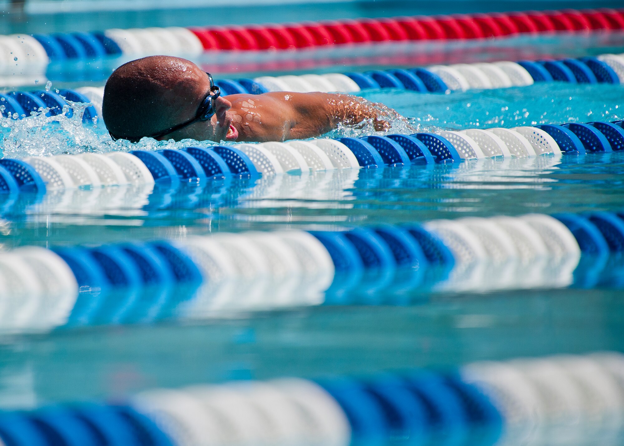 Charles Ming, a Warrior Games athlete, takes in air during an afternoon swim session at the Air Force team’s training camp at Eglin Air Force Base, Fla., April 7. The base-hosted, week-long Warrior Games training camp is the last team practice session before the yearly competition in June. (U.S. Air Force photo/Samuel King Jr.)
