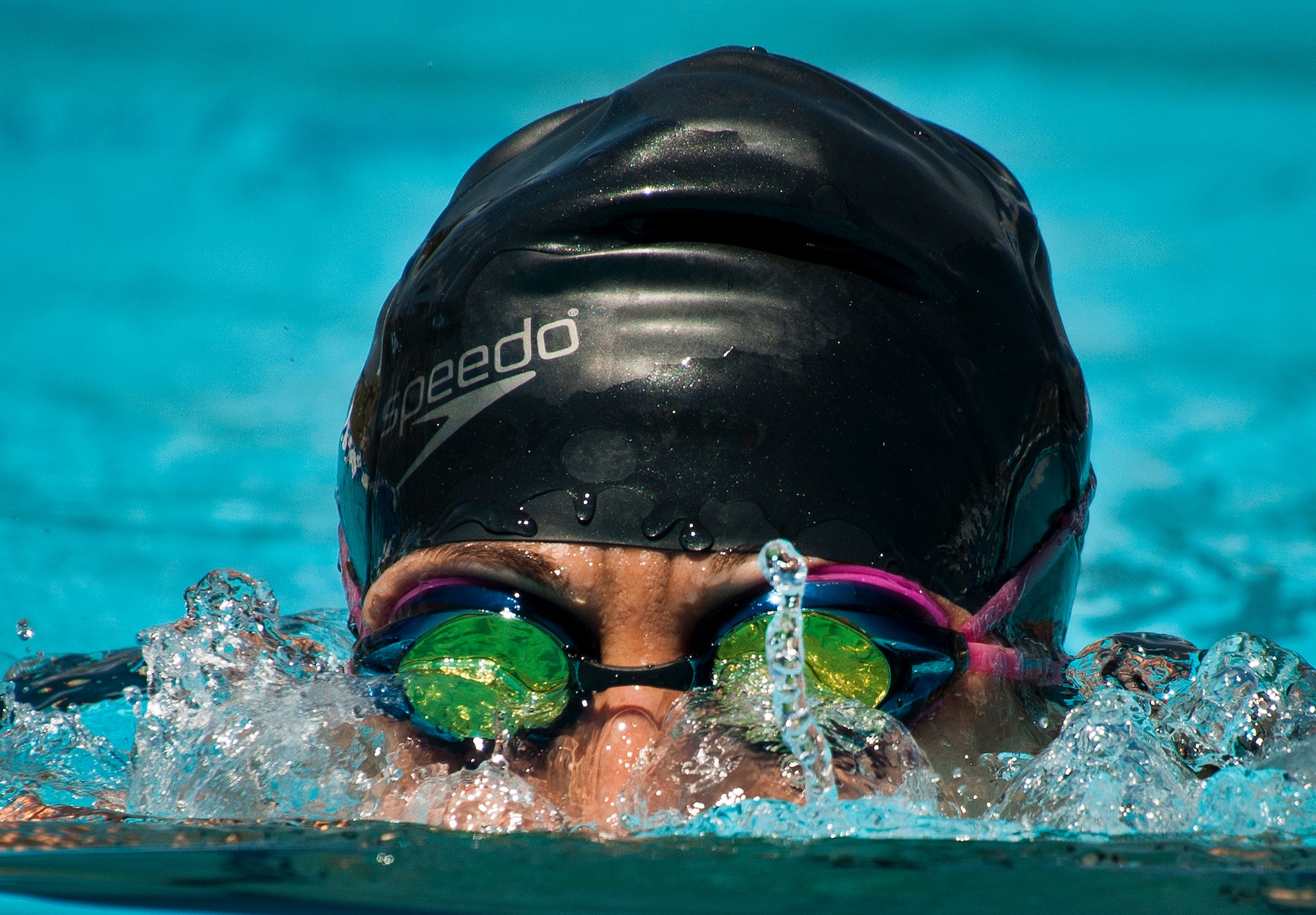 Tonya Perez, a Warrior Games athlete, lifts her head out of the water during an afternoon swim session at the Air Force team’s training camp at Eglin Air Force Base, Fla., April 7. The base-hosted, week-long Warrior Games training camp is the last team practice session before the yearly competition in June. (U.S. Air Force photo/Samuel King Jr.)