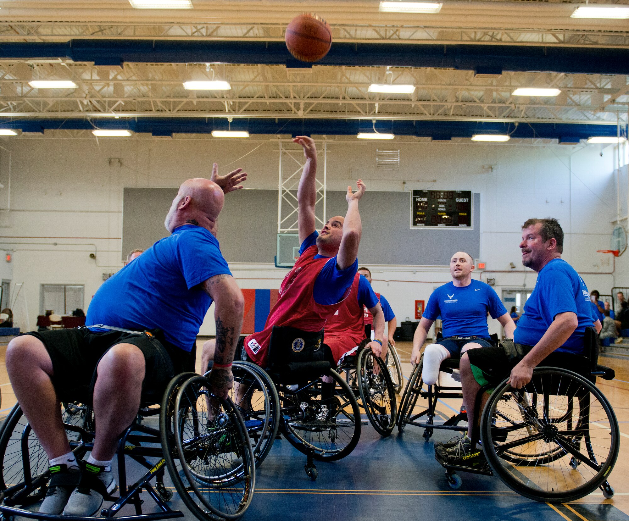 John Meyer, a Warrior Care attendee, takes a shot at the basket during an afternoon wheelchair-basketball session at the Air Force team’s training camp at Eglin Air Force Base, Fla., April 7.  The base-hosted, week-long Warrior Games training camp is the last team practice session before the yearly competition in June.  (U.S. Air Force photo/Samuel King Jr.)