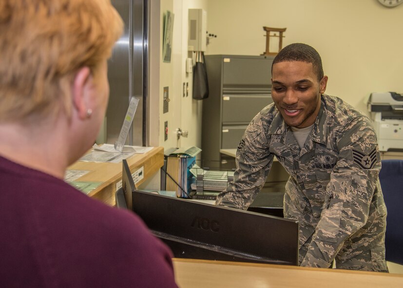 U.S. Air Force Staff Sgt. Eckron Bennett, a primary care flight administration technician with the 35th Medical Operations Squadron, attends to a patient at Misawa Air Base, Japan, April 7, 2016. Bennet’s daily duties include monitoring programs and handling business management of healthcare facilities. Bennett hails from Chattanooga, Tennessee. (U.S. Air Force photo by Airman 1st Class Jordyn Fetter)