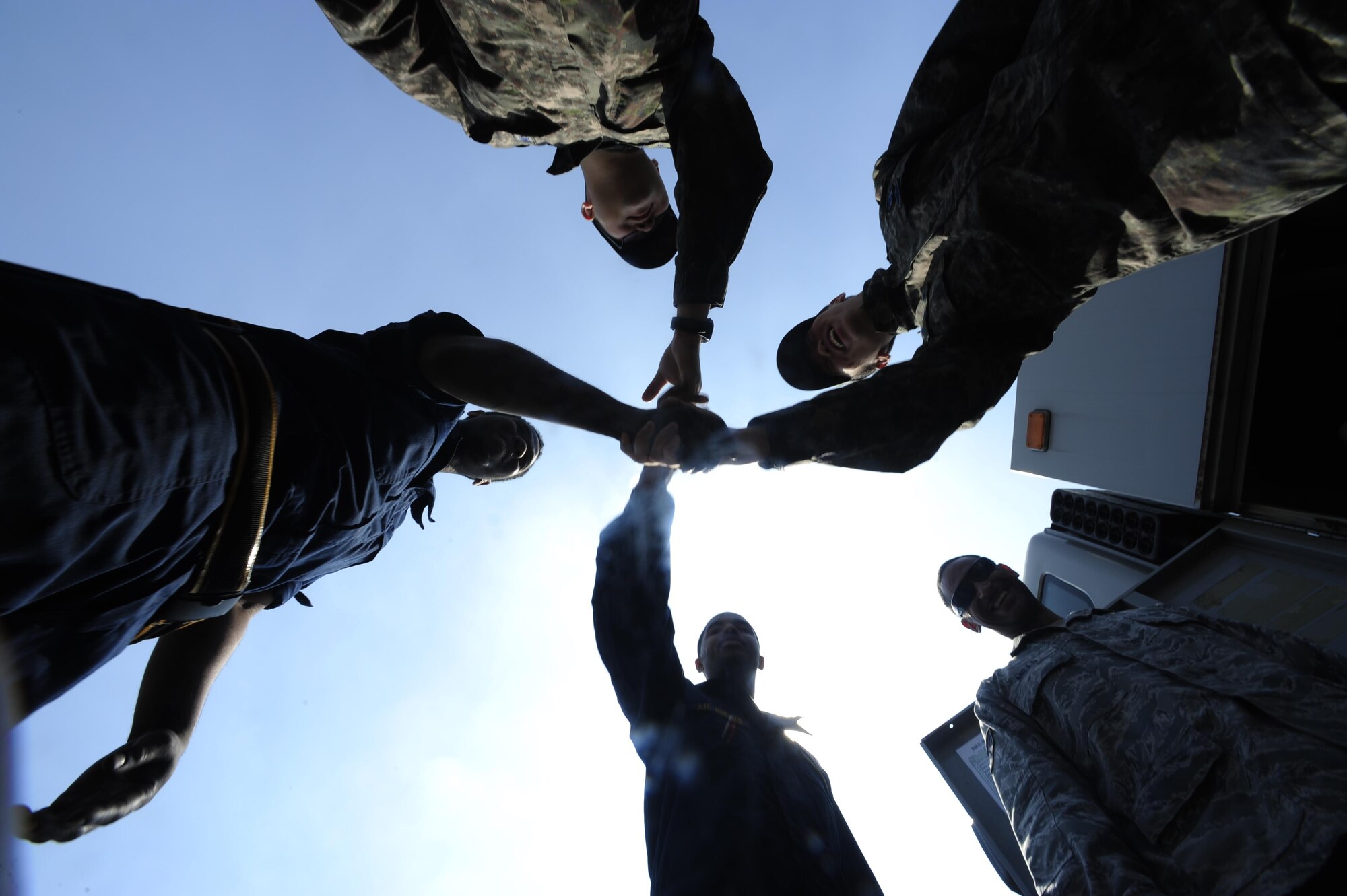 U.S. Air Force maintainers from the 80th Aircraft Maintenance Unit, Kunsan Air Base, Republic of Korea, and the Republic of Korea air force maintainers from the 19th Fighter Wing meet to shake hands during Buddy Wing 16-3 at Jungwon Air Base, Republic of Korea, March 30, 2016. Buddy Wing training, held multiple times a year, polishes the ability of the Republic of Korea and U.S. pilots to train and operate as a combined force. (U.S. Air Force photo by Staff Sgt. Nick Wilson/Released)