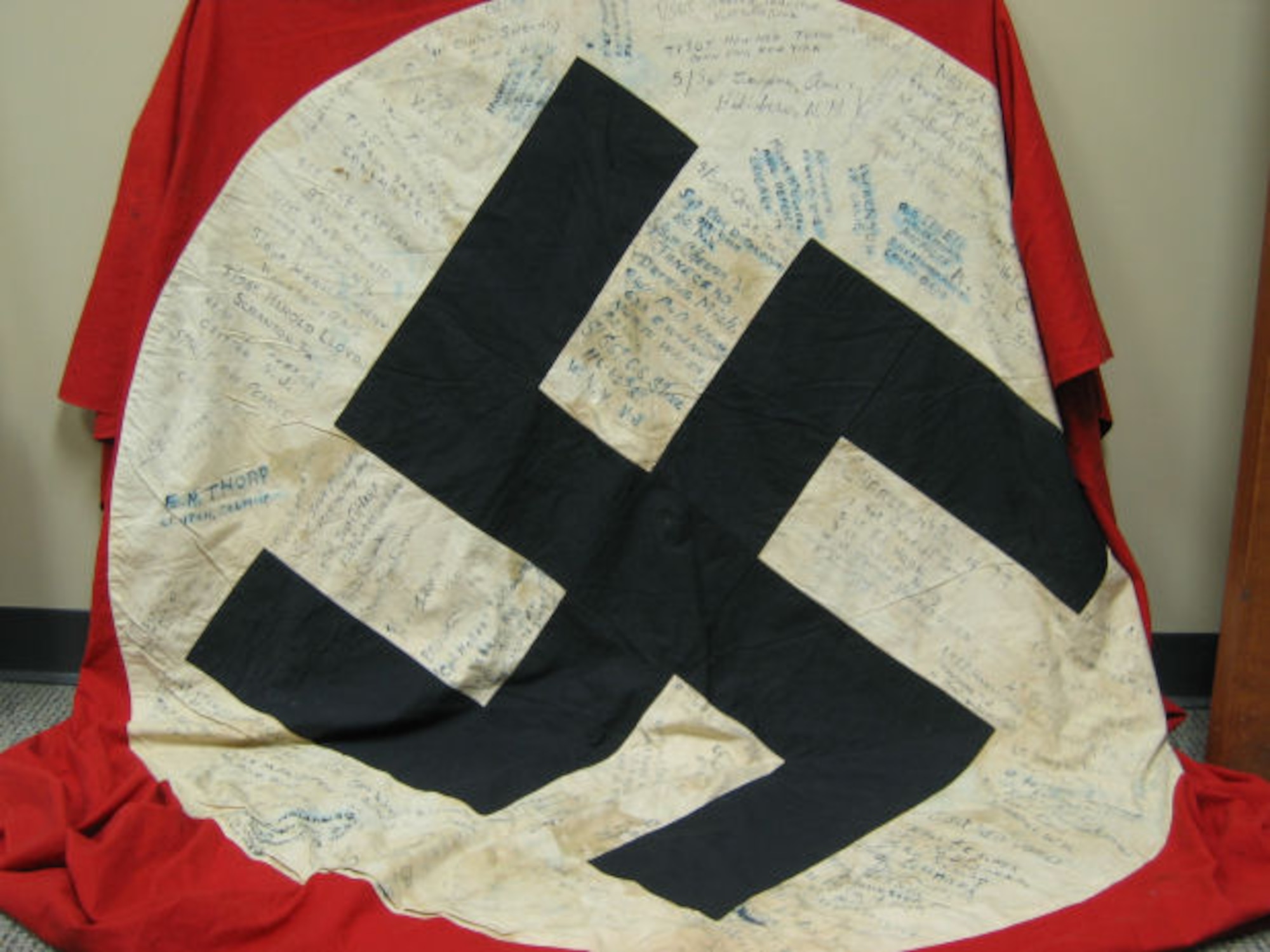 The Moosburg POW flag, which flew over the city hall in Moosburg, Germany, before it was replaced by General Patton’s troops with the American flag in late April, 1945. It was signed by more than 100 former POWs, including Luther P. Canup. (Courtesy 303rd Bomb Group Association)