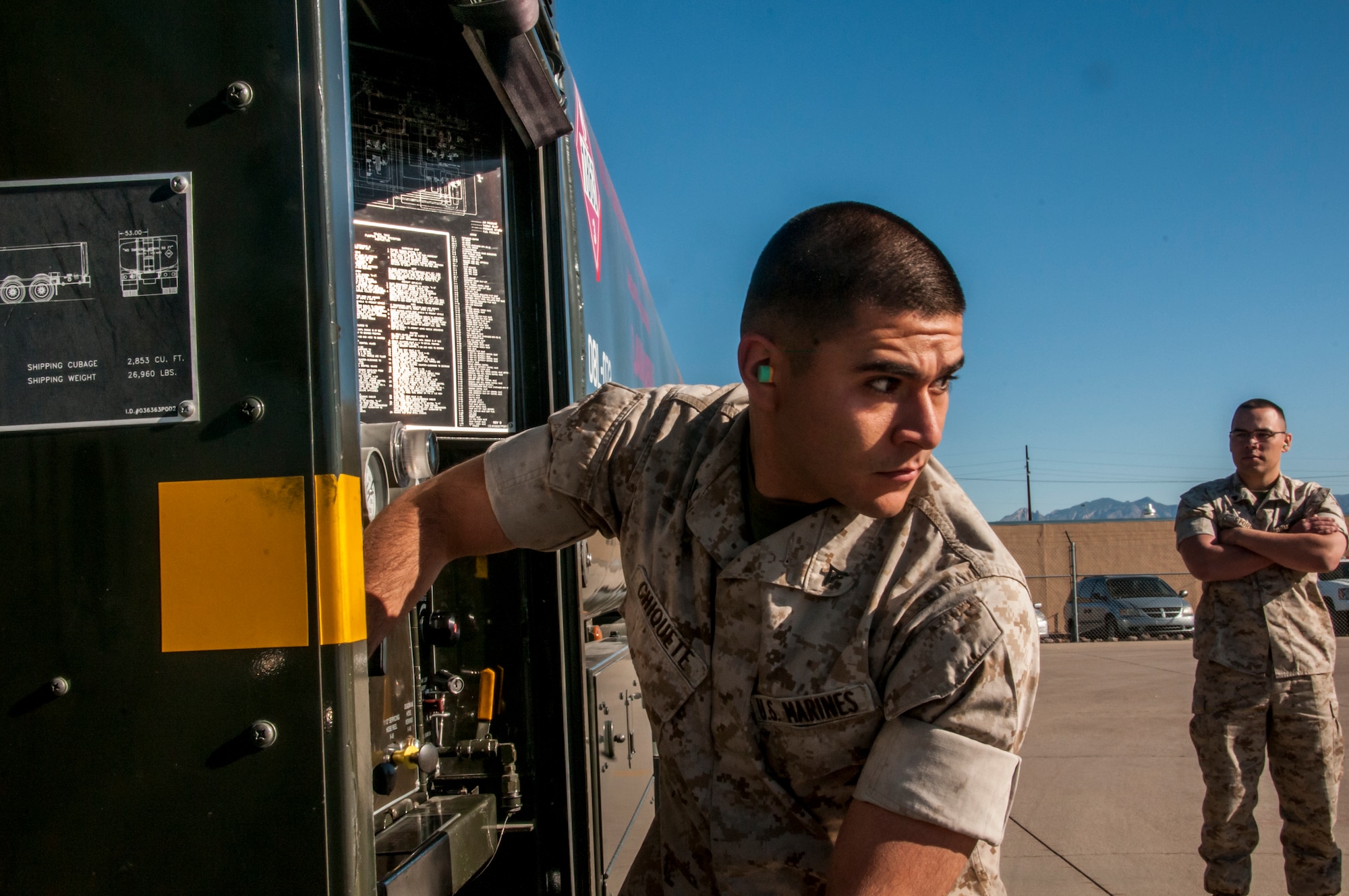 Marine Corps Lance Cpl. Alejandro Chiquette, a bulk fuel specialist from Bulk Fuel Company Alpha, 6th Engineer Support Battalion, practices tending to the pumping system on a truck engine, which eventually transfers the fuel to a jet.  Beginning in late March and ending in early June, the Marines will be training and executing operational tasks at the 162nd Wing.  (U.S Air National Guard Photo by Tech. Sgt. Erich B. Smith/Released)