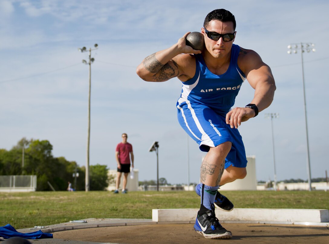 Wounded Warrior Vince Cavazos winds up for a shot put toss during a morning track and field session at the Air Force team’s training camp at Eglin Air Force Base, Fla., April 6, 2016. The base hosted a week-long Warrior Games training camp, which is the last team practice session before the yearly competition in June. Air Force photo by Samuel King Jr.