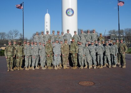 U.S. Army Col. David Wills, U.S. Strategic Command (USSTRATCOM) deputy director C4 Systems, and other USSTRATCOM leaders pose for a photo with Creighton University, University of Nebraska at Omaha and University of Nebraska at Lincoln U.S. Army Reserve Officers Training Corps (ROTC) students during their visit to USSTRATCOM at Offutt Air Force Base, Neb., April 8, 2016.  During their visit, ROTC students toured the Global Operations Center and received mentorship from USSTRATCOM U.S. Army officers and senior noncommissioned officers. The visit is part of USSTRATCOM's ongoing effort to build enduring relationships with academia, including ROTC, and partner organizations. One of nine DoD unified combatant commands, USSTRATCOM has global strategic missions, assigned through the Unified Command Plan, which include strategic deterrence; space operations; cyberspace operations; joint electronic warfare; global strike; missile defense; intelligence, surveillance and reconnaissance; combating weapons of mass destruction; and analysis and targeting. (USSTRATCOM photo by Steve Cunningham)