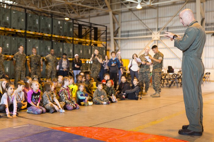 Col. Daniel L. Shipley, Marine Aircraft Group 12 commanding officer, speaks to children of service member’s assigned MAG-12 during Junior Recruit Day at Marine Corps Air Station Iwakuni, Japan, April 8, 2016. Junior Recruit Day allowed the children to get a first-hand look at what their military parent’s experiences on a daily basis. (U.S. Marine Corps photo by Sgt. Antonio J. Rubio)