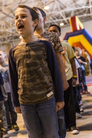 Andrew Carr sounds off during Junior Recruit Day at Marine Corps Air Station Iwakuni, Japan, April 8, 2016. Junior Recruit Day allowed the children of service member’s assigned Marine Aircraft Group 12 to get a first-hand look at what their military parents’ experiences on a daily basis. (U.S. Marine Corps photo by Sgt. Antonio J. Rubio)