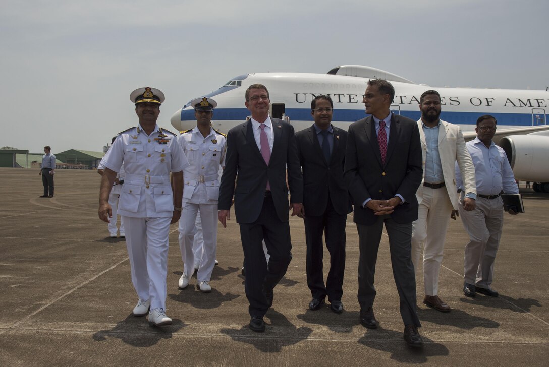 Defense Secretary Ash Carter, left, walks with U.S. Ambassador to India Richard Verma, right, as he arrives in Goa, India, April 10, 2016. Carter is visiting India and the Philippines to solidify the U.S. rebalance to the Asia-Pacific region. DoD photo by Air Force Senior Master Sgt. Adrian Cadiz