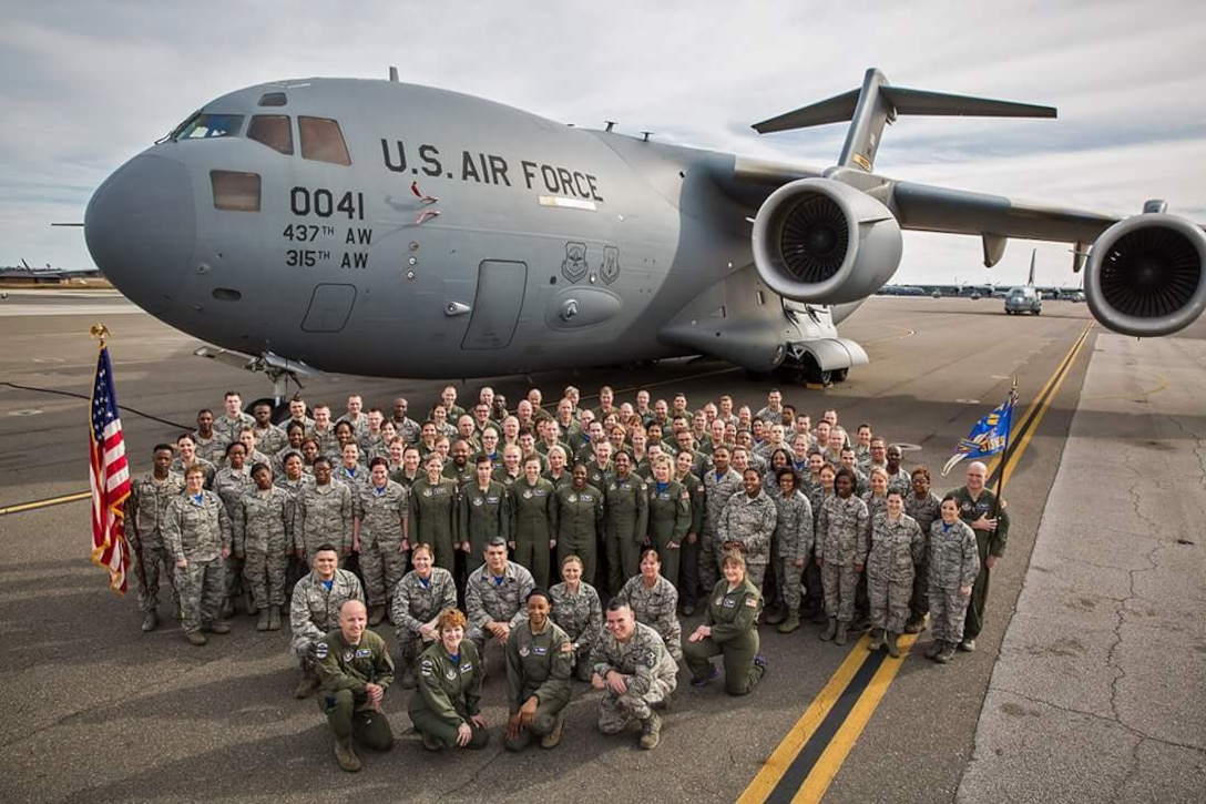 Airmen assigned to the 315th Aeromedical Evacuation Squadron, Joint Base Charleston, S.C., pose for a squadron photo in front of a C-17 Globemaster III aircraft. The C-17 can be turned into a flying hospital, delivering medical supplies and emergency assistance to those in need, around the globe.
