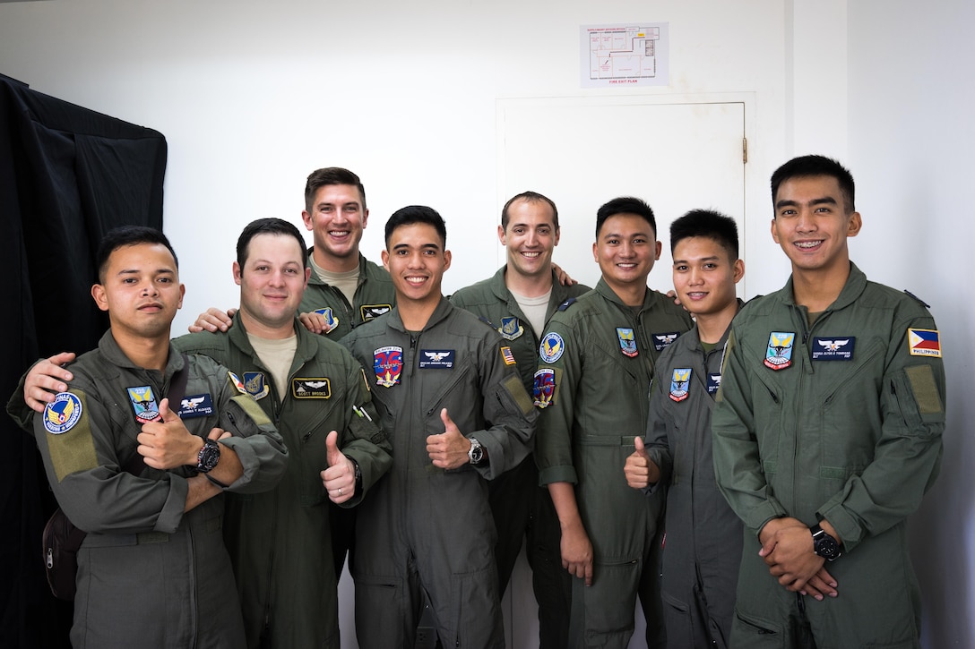 U.S. Air Force pilots from the 36th Airlift Squadron join Philippine Air Force pilots from the 220th Airlift Wing for a photos during Exercise Balikatan on Mactan-Benito Ebuen Air Base, Philippines, April 7, 2016. Balikatan, a Filipino term meaning “shoulder-to-shoulder,”  is an annual bilateral exercise between the Armed Forces of the Phillippines and U.S. military, which focuses on Philippine-U.S. partnership, humanitarian assistance and disaster relief capabilities.