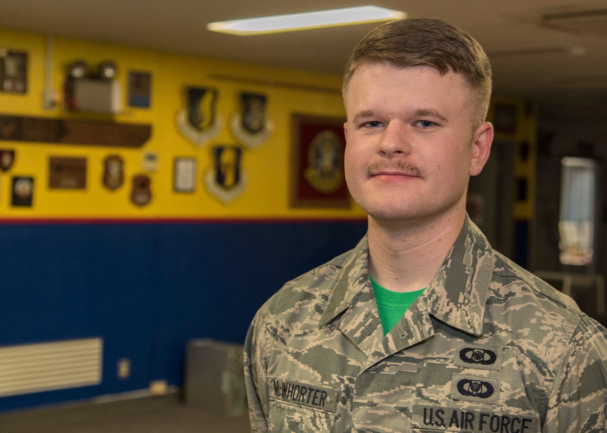U.S. Air Force Senior Airman Christopher McWhorter, a weapons director with the 610th Air Control Flight, poses for a Wild Weasel of the Week portrait at Misawa Air Base, Japan, April 8, 2016. McWhorter provides guidance and support for F-16 Fighting Falcon pilots by planning and briefing offensive and defensive counter-missions, ensuring safety in flight. McWhorter hails from Nashville, Tennessee. (U.S. Air Force photo by Airman 1st Class Jordyn Fetter)