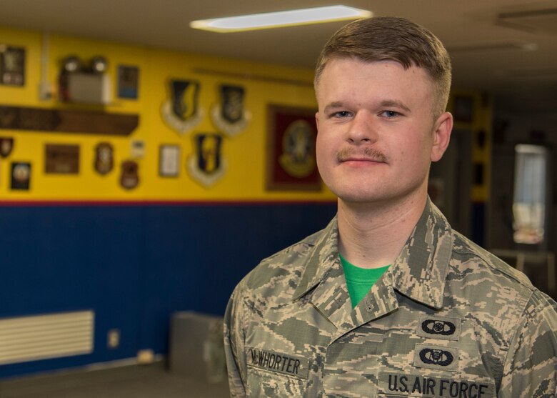 U.S. Air Force Senior Airman Christopher McWhorter, a weapons director with the 610th Air Control Flight, poses for a Wild Weasel of the Week portrait at Misawa Air Base, Japan, April 8, 2016. McWhorter provides guidance and support for F-16 Fighting Falcon pilots by planning and briefing offensive and defensive counter-missions, ensuring safety in flight. McWhorter hails from Nashville, Tennessee. (U.S. Air Force photo by Airman 1st Class Jordyn Fetter)