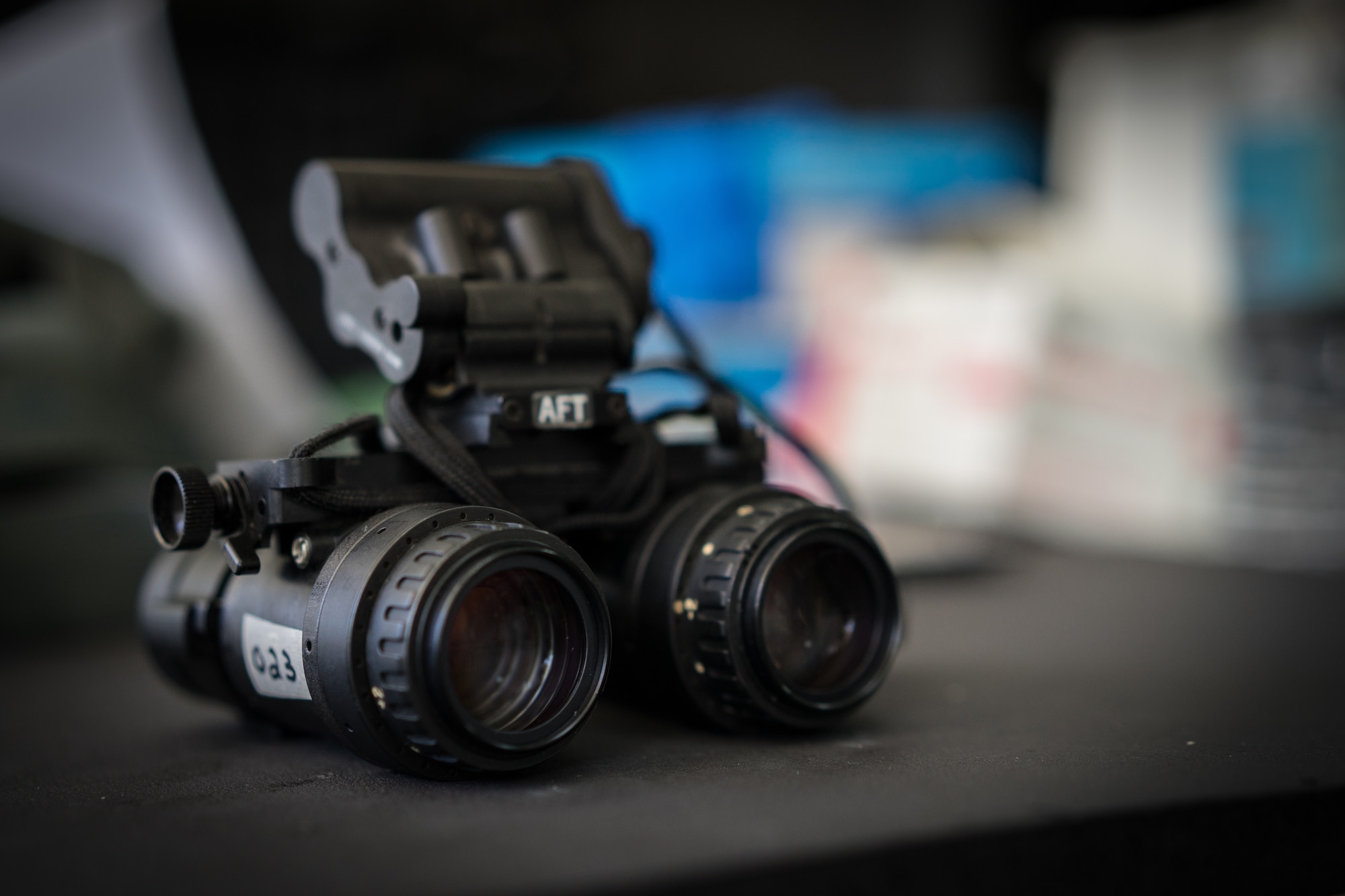 Night vision googles sit displayed on a table during Exercise Balikatan on Mactan-Benito Ebuen Air Base, Philippines, April 7, 2016. Pilots and loadmasters from Yokota Air Base’s 36th Airlift Squadron shared their knowledge of using NVGs while flying, during an all-day training session. (U.S. Air Force photo by Staff Sgt. Michael Smith/ Released)
