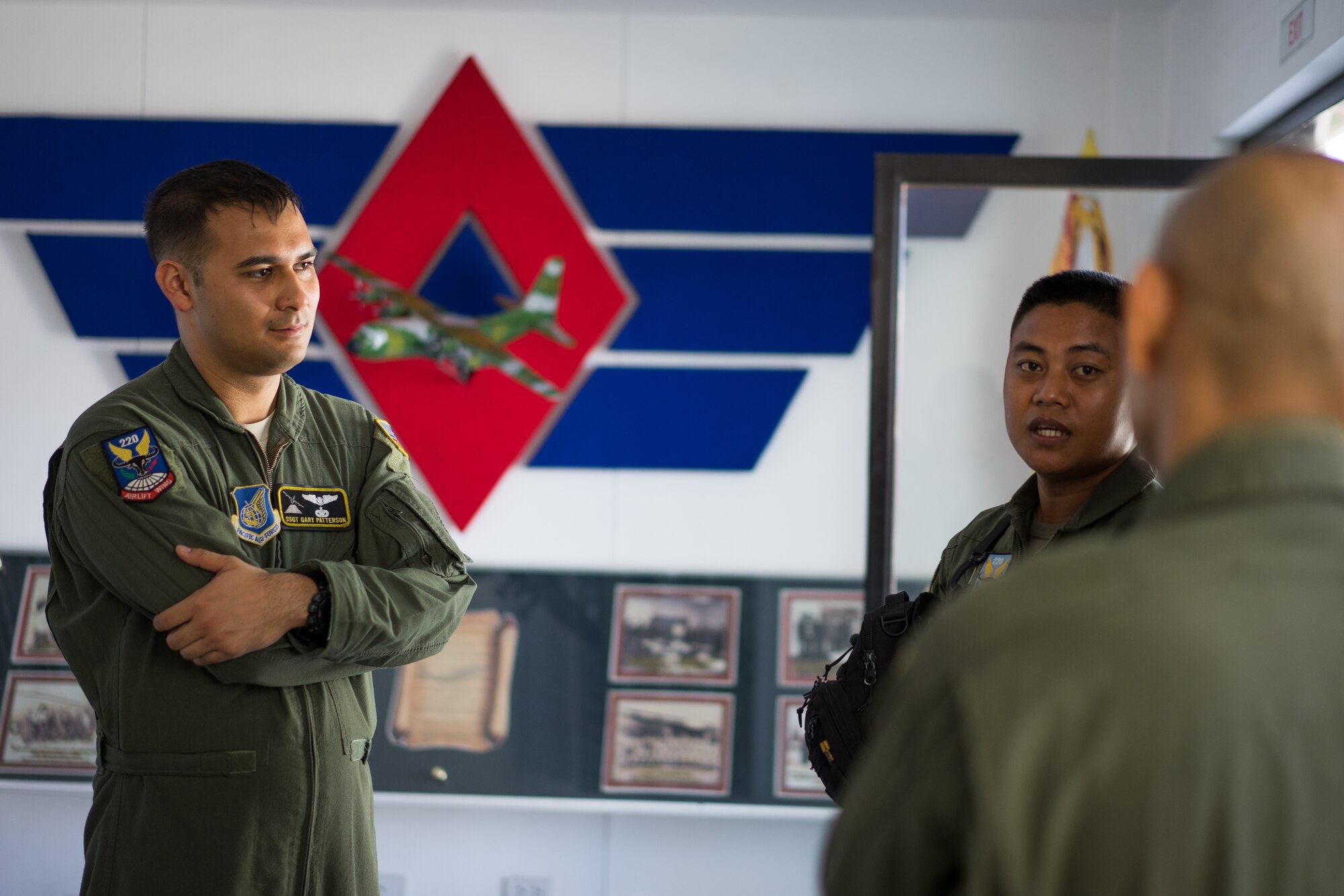U.S. Air Force Staff Sgt. Gary Patterson, 36th Airlift Squadron C-130 loadmaster, discusses what it means to be a loadmaster with Philippine Air Force (PAF) loadmasters from the 220th Airlift Wing during an Exercise Balikatan training session on Mactan-Benito Ebuen Air Base, Philippines, April 7, 2016. Loadmasters from the PAF not only have their loadmaster duties, but also have one or two additional jobs varying from maintenance to combat roles. (U.S. Air Force photo by Staff Sgt. Michael Smith/ Released)