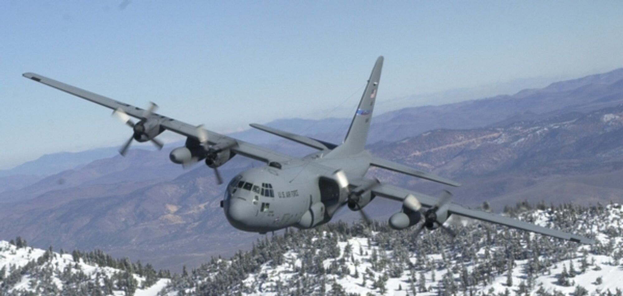 This file photo shows a 152nd Airlift Wing C-130 flying over the Sierra mountain range near Lake Tahoe. 152nd Airlift Wing photo