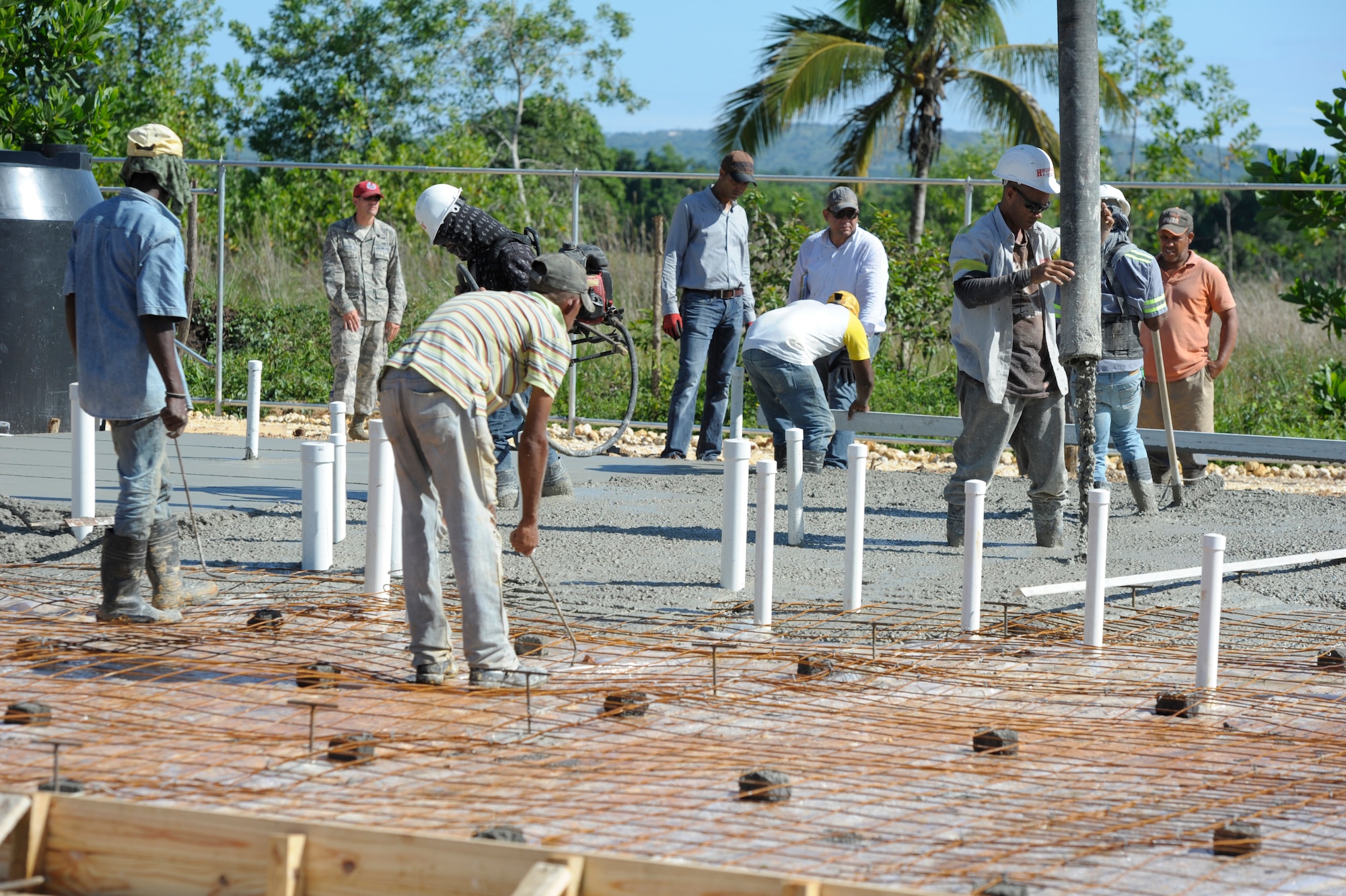 Dominican contractors fill a foundation with concrete for a new hospital in Copeyito, Dominican Republic as part of Exercise NEW HORIZONS 2016, Apr. 7, 2016. NEW HORIZONS enhances U.S. military training and readiness by giving military civil engineers an opportunity to hone their craft and train for humanitarian assistance or disaster relief situations. Members of the 820th RED HORSE Squadron, from Nellis Air Force Base, Nevada, provide Quality Control and Quality Assurance during the foundation preparation. (U.S. Air Force photo by Master Sgt. Chenzira Mallory/Released)