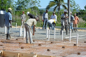 Dominican contractors fill a foundation with concrete for a new hospital in Copeyito, Dominican Republic as part of Exercise NEW HORIZONS 2016, Apr. 7, 2016. NEW HORIZONS enhances U.S. military training and readiness by giving military civil engineers an opportunity to hone their craft and train for humanitarian assistance or disaster relief situations. Members of the 820th RED HORSE Squadron, from Nellis Air Force Base, Nevada, provide Quality Control and Quality Assurance during the foundation preparation. (U.S. Air Force photo by Master Sgt. Chenzira Mallory/Released)