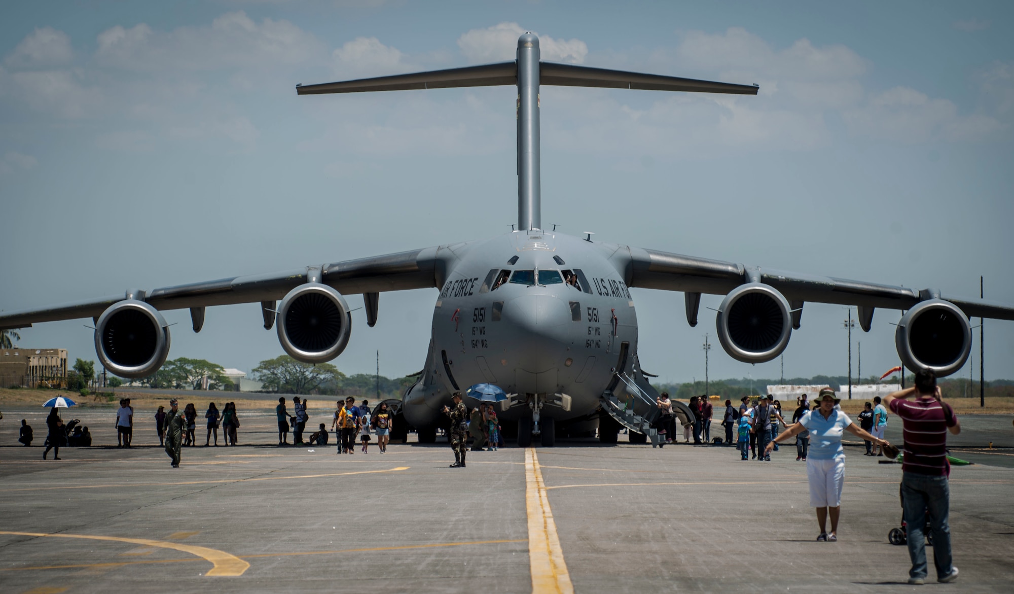 Locals take photos of a U.S. Air Force C-17 Globemaster III assigned to the 15th Wing, Hickam Air force Base, Hawaii during a static display at Clark Air Base, Philippines, April 9, 2016. U.S. military and Armed Forces of the Philippines hosted the event displaying various aircraft from all U.S. services and the Philippine Air Force. This year marks the 32nd iteration of Balikatan where U.S. service members continue to work “shoulder-to-shoulder” with members of the Armed Forces of the Philippines to increase combined readiness to crises and conflict across the Indo-Asia-Pacific region. (U.S. Air Force photo by Tech. Sgt. Araceli Alarcon/Released)