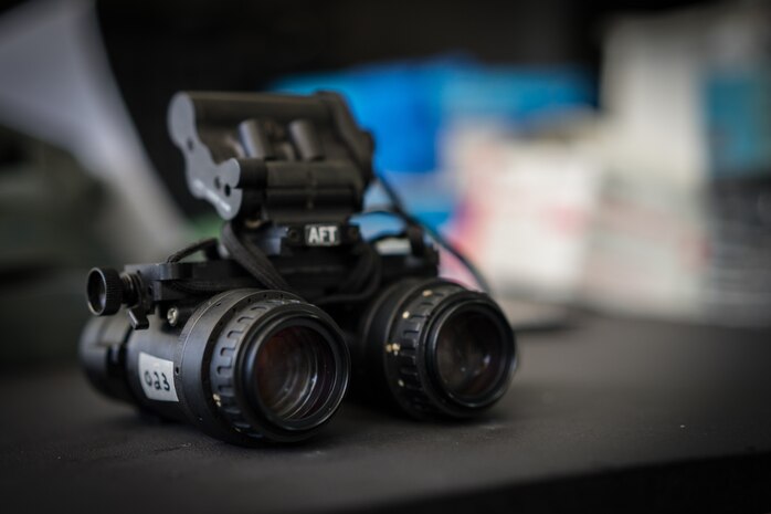 Night vision googles sit displayed on a table during Exercise Balikatan on Mactan-Benito Ebuen Air Base, Philippines, April 7, 2016. Pilots and loadmasters from Yokota Air Base’s 36th Airlift Squadron shared their knowledge of using NVGs while flying, during an all-day training session. (U.S. Air Force photo by Staff Sgt. Michael Smith/ Released)