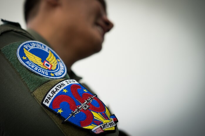 A Philippine Air Force loadmaster from the 220th Airlift Wing shows off his 36th Airlift Wing Exercise Balikatan patch during a training session on Mactan-Benito Ebuen Air Base, Philippines, April 7, 2016. Pilots and loadmasters from Yokota Air Base’s 36th AS shared their airflifting knowledge during an all-day training session. (U.S. Air Force photo by Staff Sgt. Michael Smith/ Released)