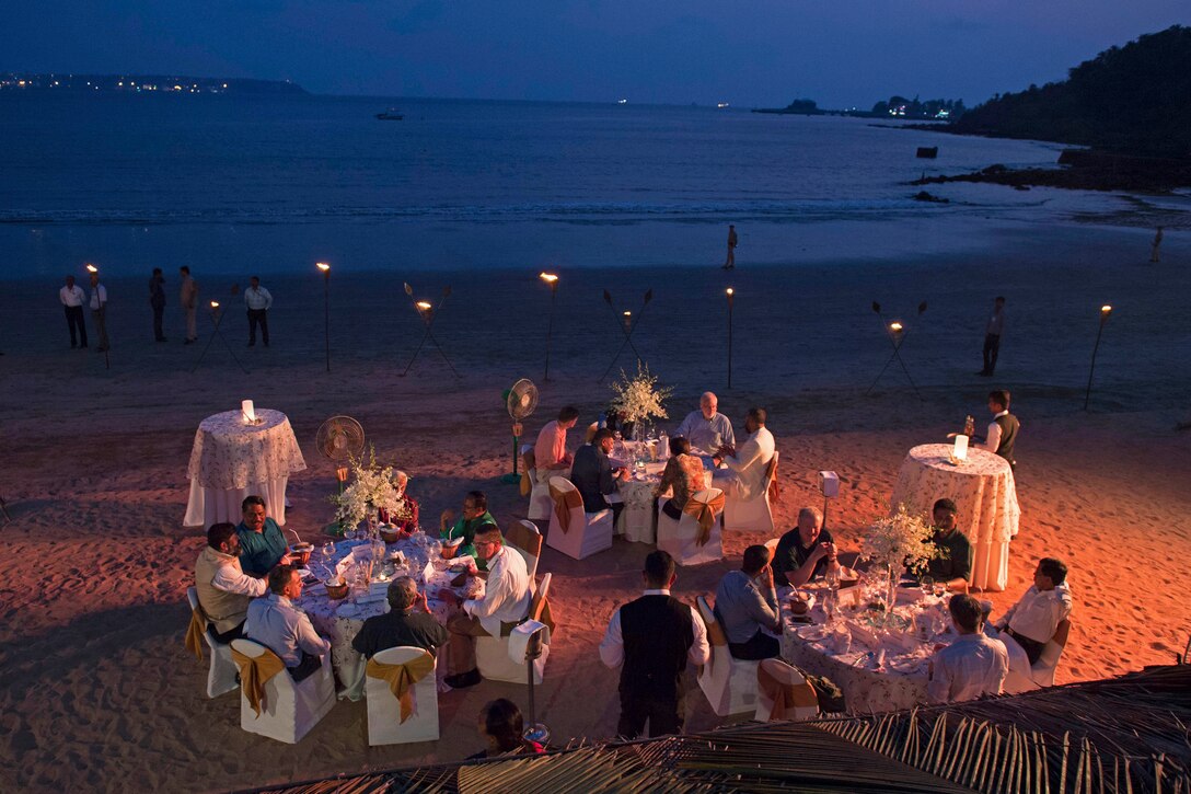 Defense Secretary Ash Carter talks with Indian Defense Minister Manohar Parrikar during a welcome dinner in his honor by the beach   in Goa, India, April 10, 2016. Carter is visiting India to solidify the rebalance to the Asia-Pacific region. DoD photo by Air Force Senior Master Sgt. Adrian Cadiz